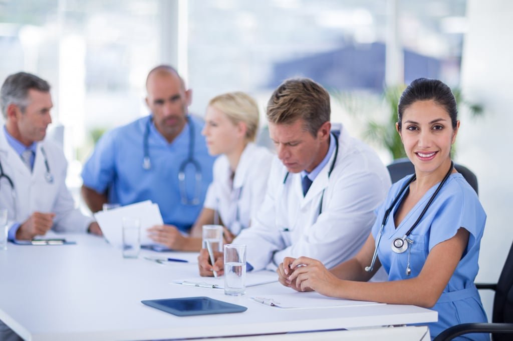 LMI Waiver for Medical and other Professionals in Australia Professionals discussing home loan options with LMI waiver benefits to reduce upfront buying costs